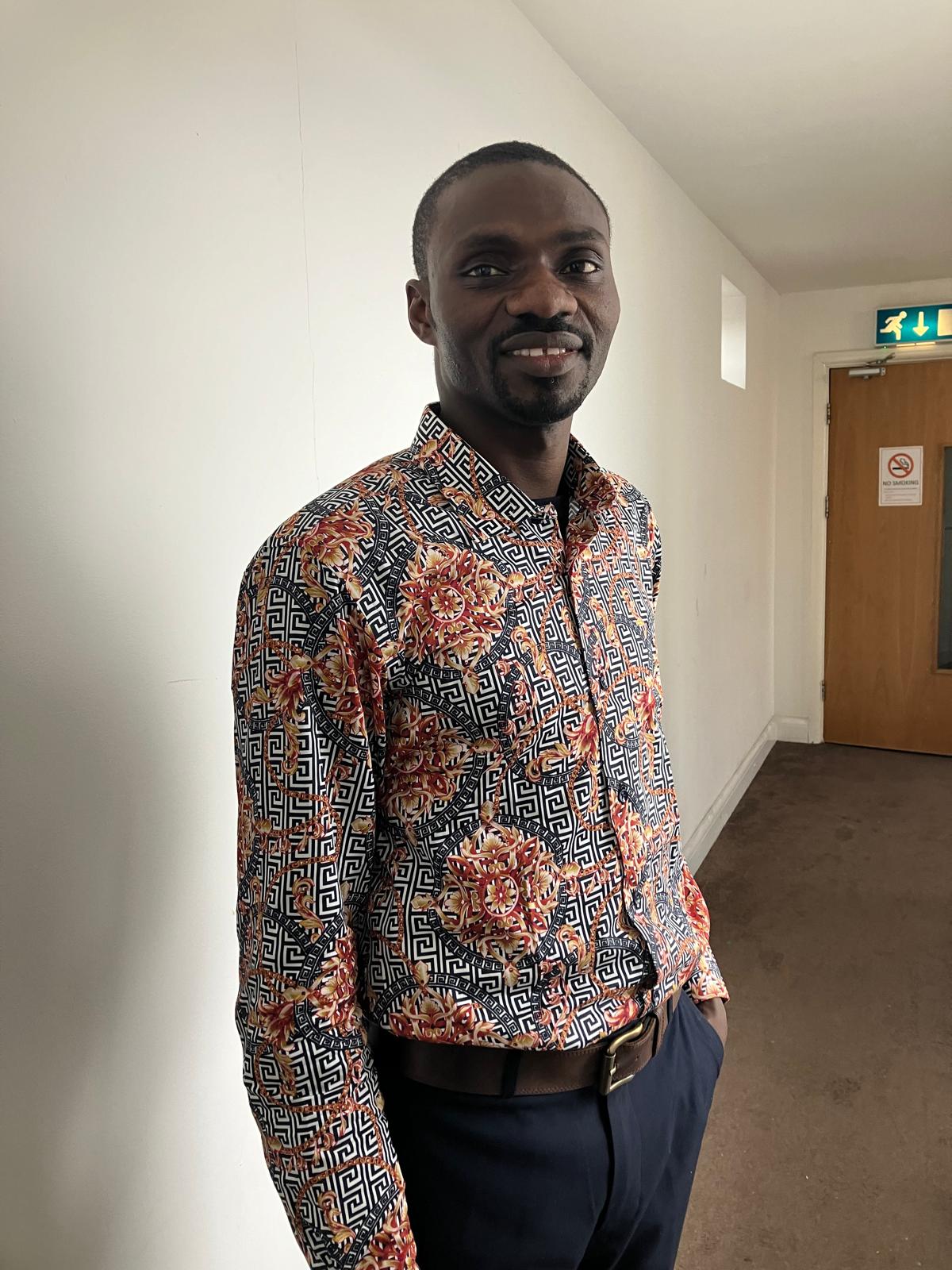 Pastor Samuel Yakubu wearing a patterned shirt